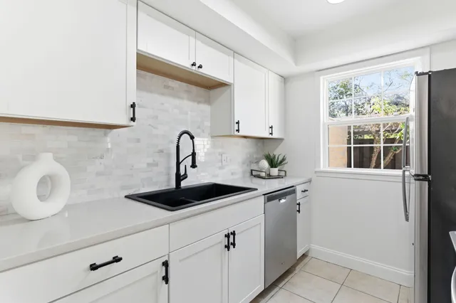 a kitchen with a sink and cabinets