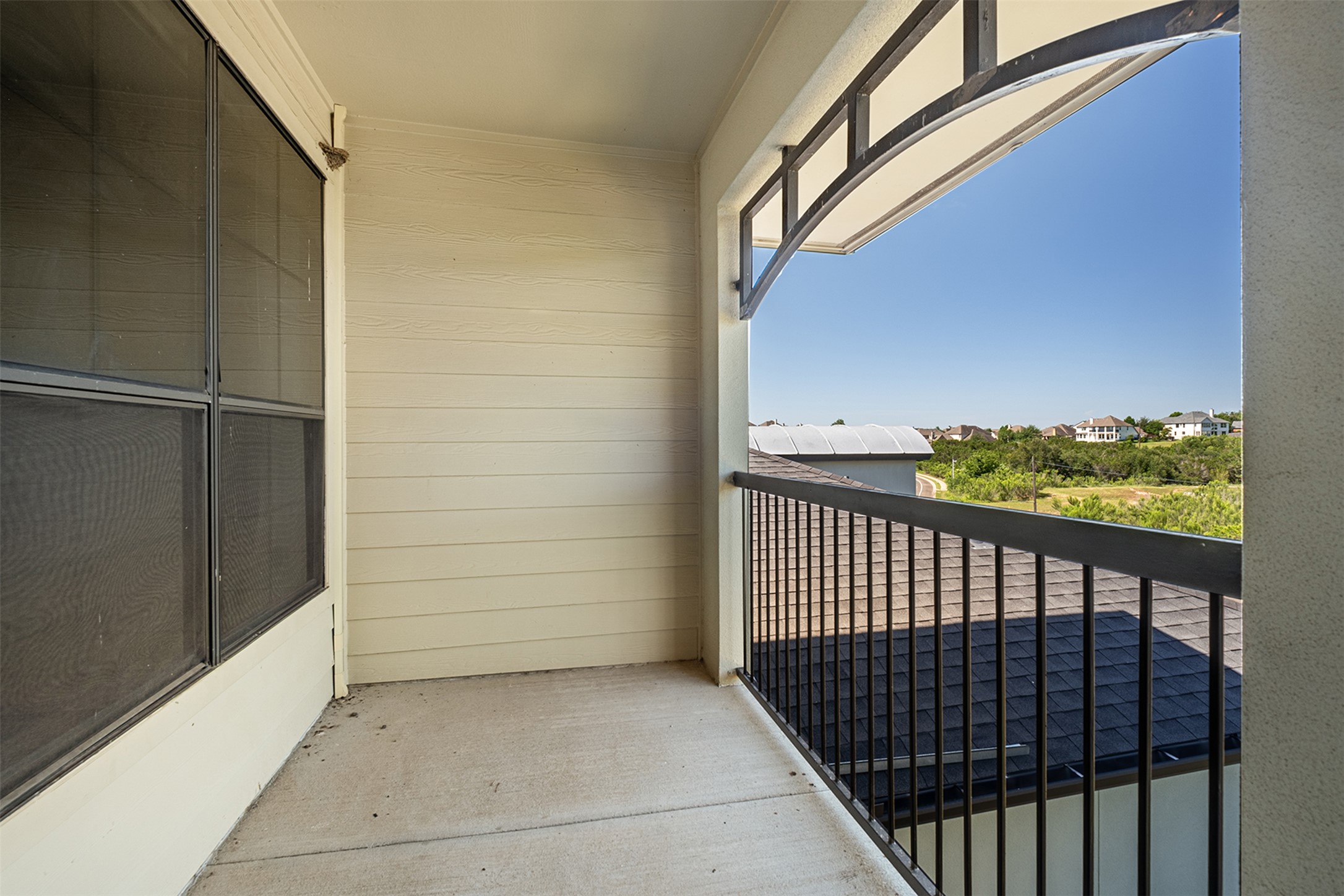 7701 Rialto Boulevard, Unit 637 Austin, TX 78735 - Photo 23 of 25 Step out onto this secluded private balcony and survey the serene neighborhood vista.