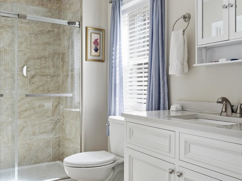 67 Ling Street Fall River, MA 02720 - Photo 16 of 32 a bathroom with a sink a toilet and shower