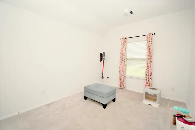 a view of a house with a yard and a porch