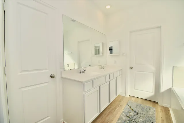 a bathroom with a shower and a bath tub