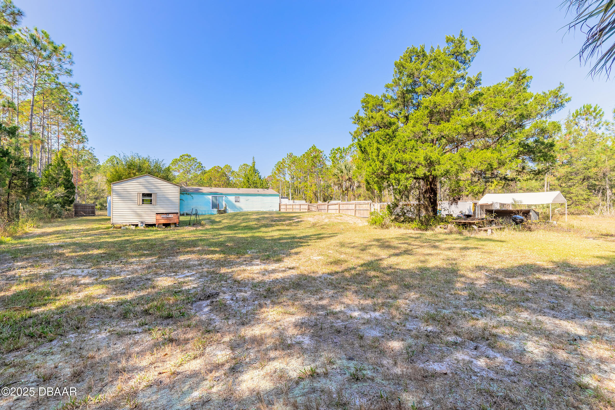 2127 Oak Street Bunnell, FL 32110 - Photo 11 of 48 a view of a field with big trees