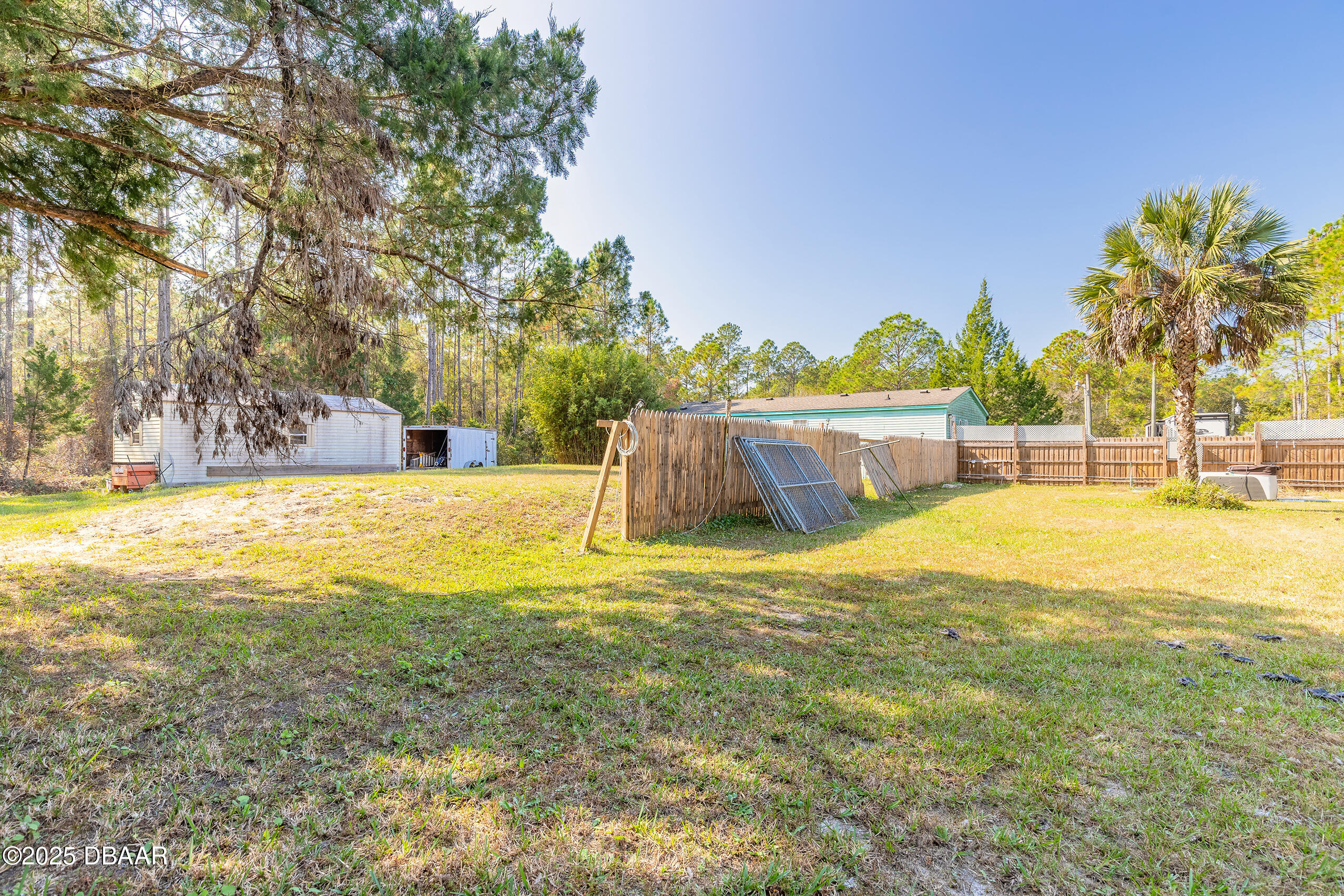 2127 Oak Street Bunnell, FL 32110 - Photo 12 of 48 a swimming pool with an outdoor space and seating area