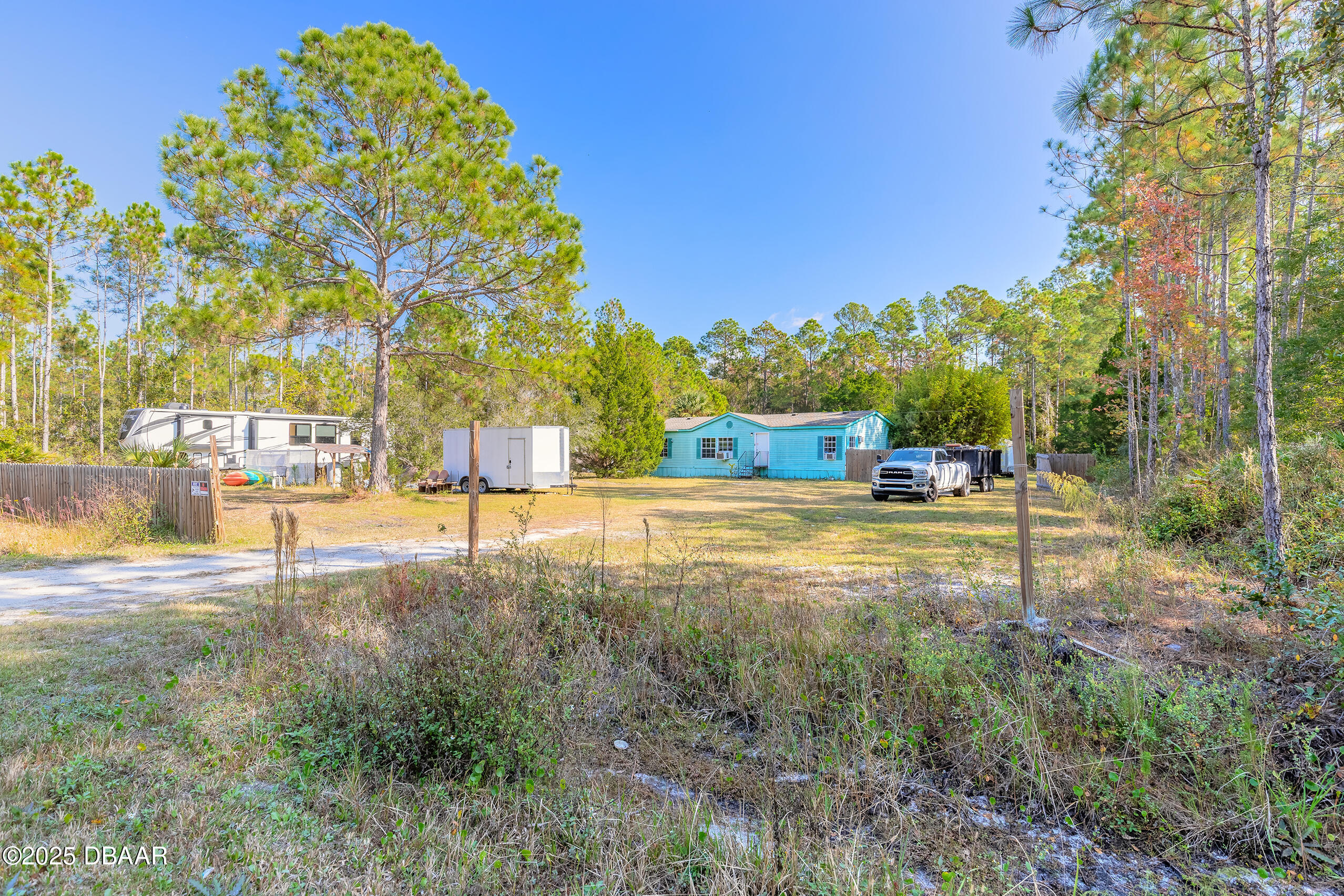 2127 Oak Street Bunnell, FL 32110 - Photo 2 of 48 a view of yard with swimming pool and trees