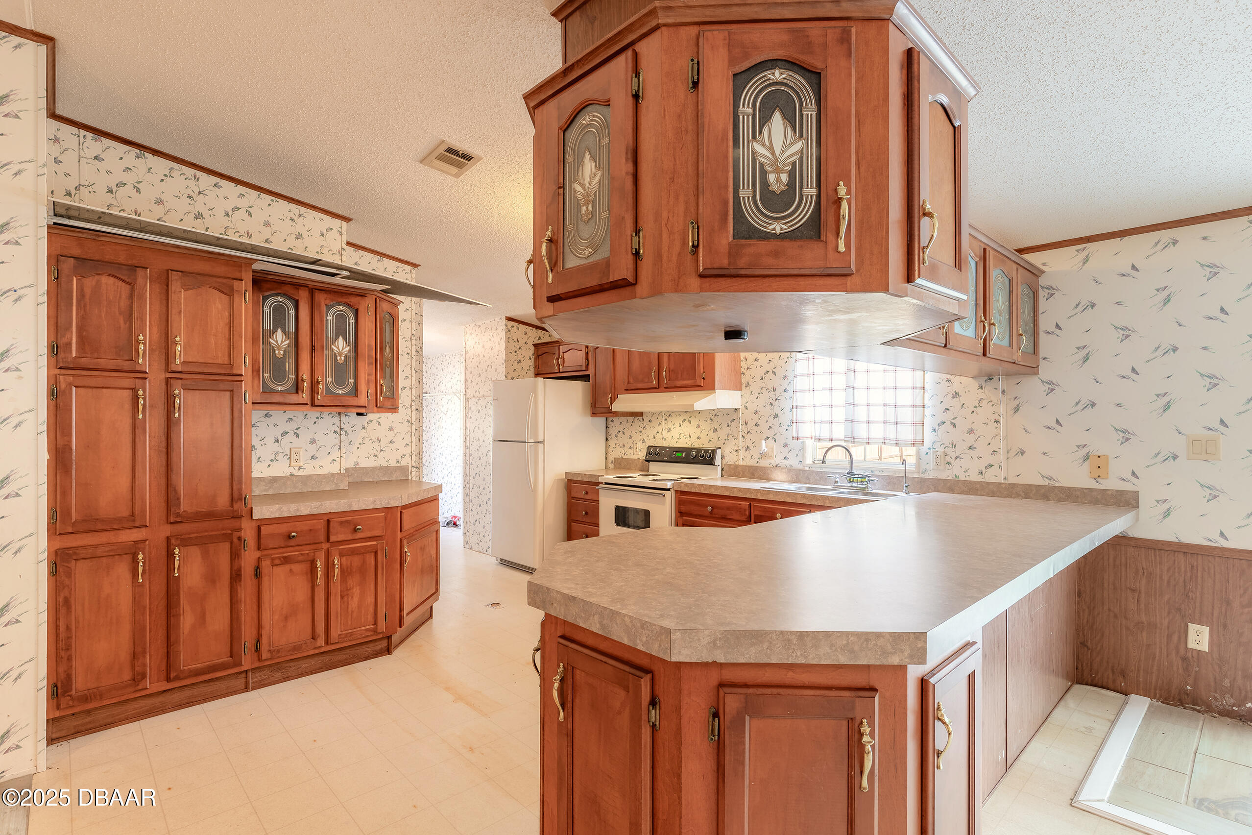 2127 Oak Street Bunnell, FL 32110 - Photo 28 of 48 a kitchen with stainless steel appliances granite countertop a sink and cabinets