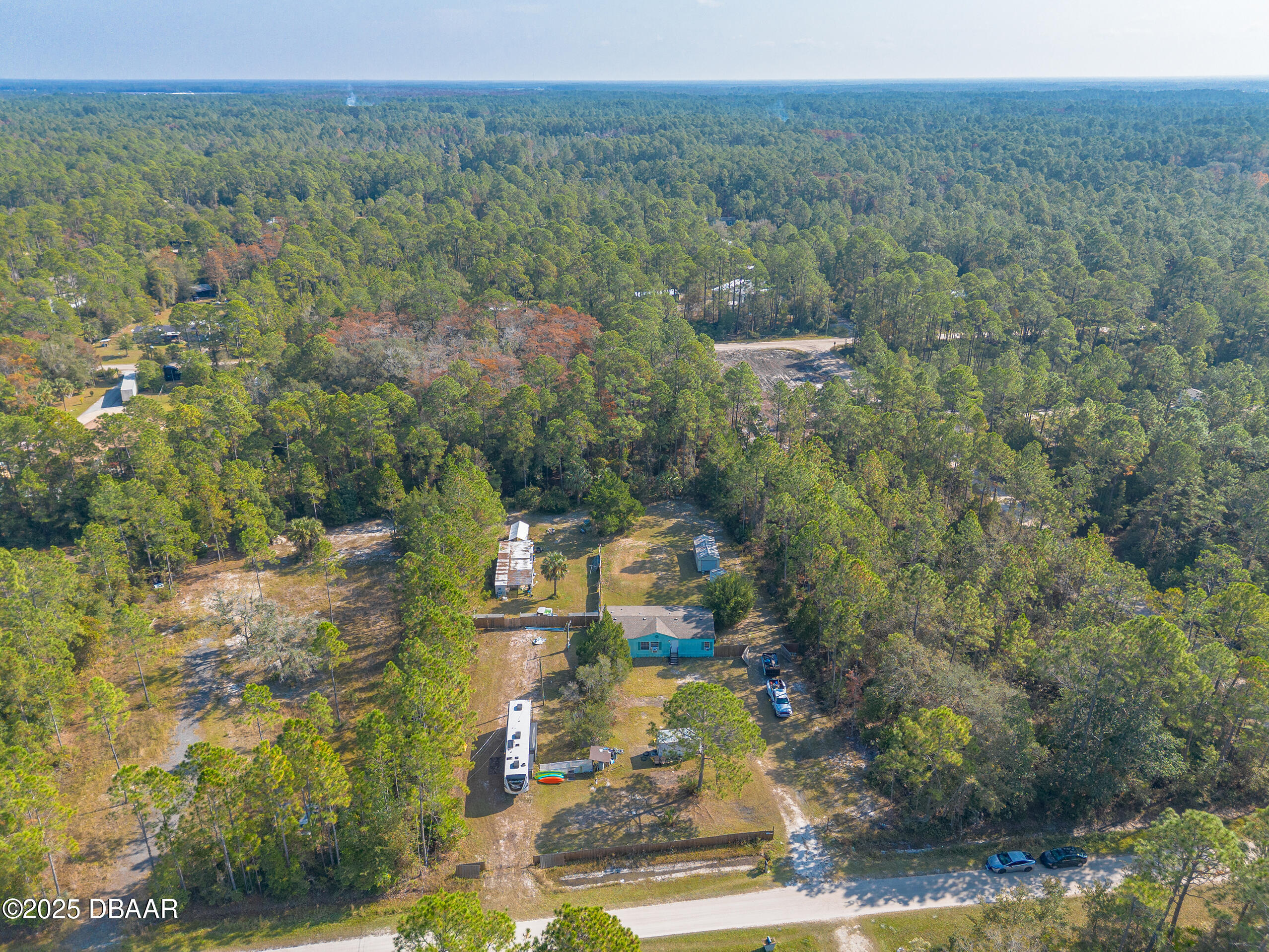 2127 Oak Street Bunnell, FL 32110 - Photo 34 of 48 a view of a city with lush green forest