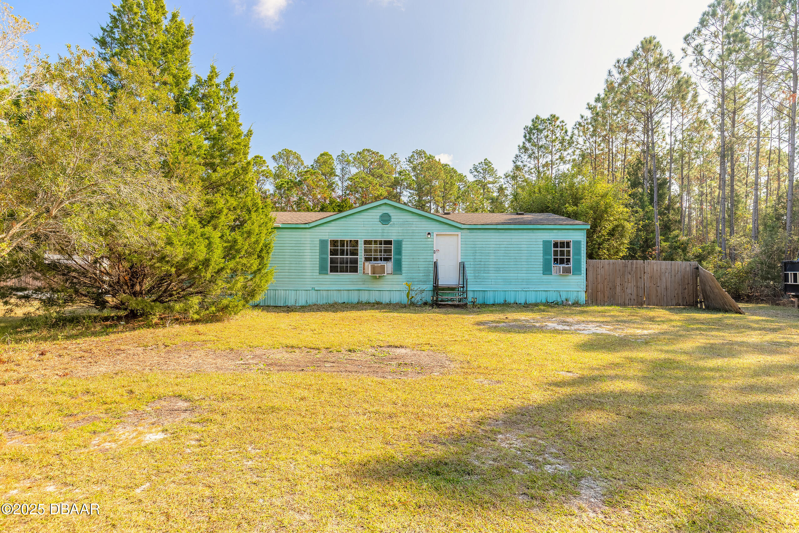 2127 Oak Street Bunnell, FL 32110 - Photo 5 of 48 a view of a house with a swimming pool