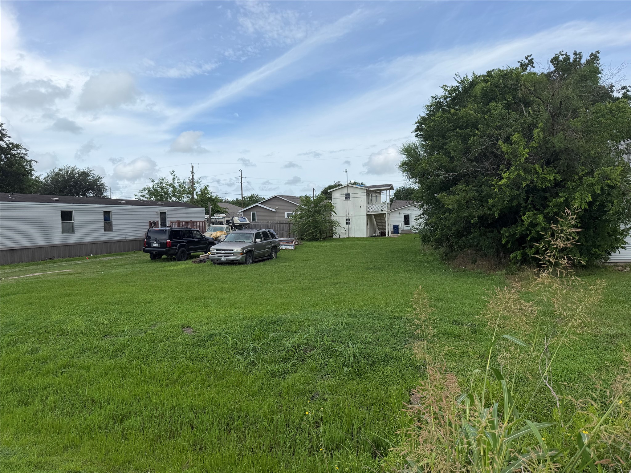 Lot 16 Gin Road Kendleton, TX 77417 - Photo 2 of 8 a view of a field of grass and trees