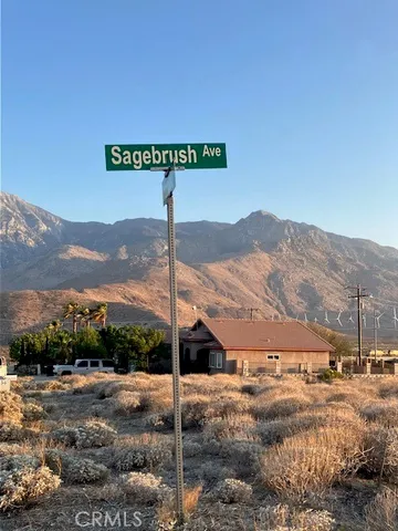 a view of a street with a building in the background
