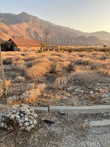 a view of a road with mountains in the background