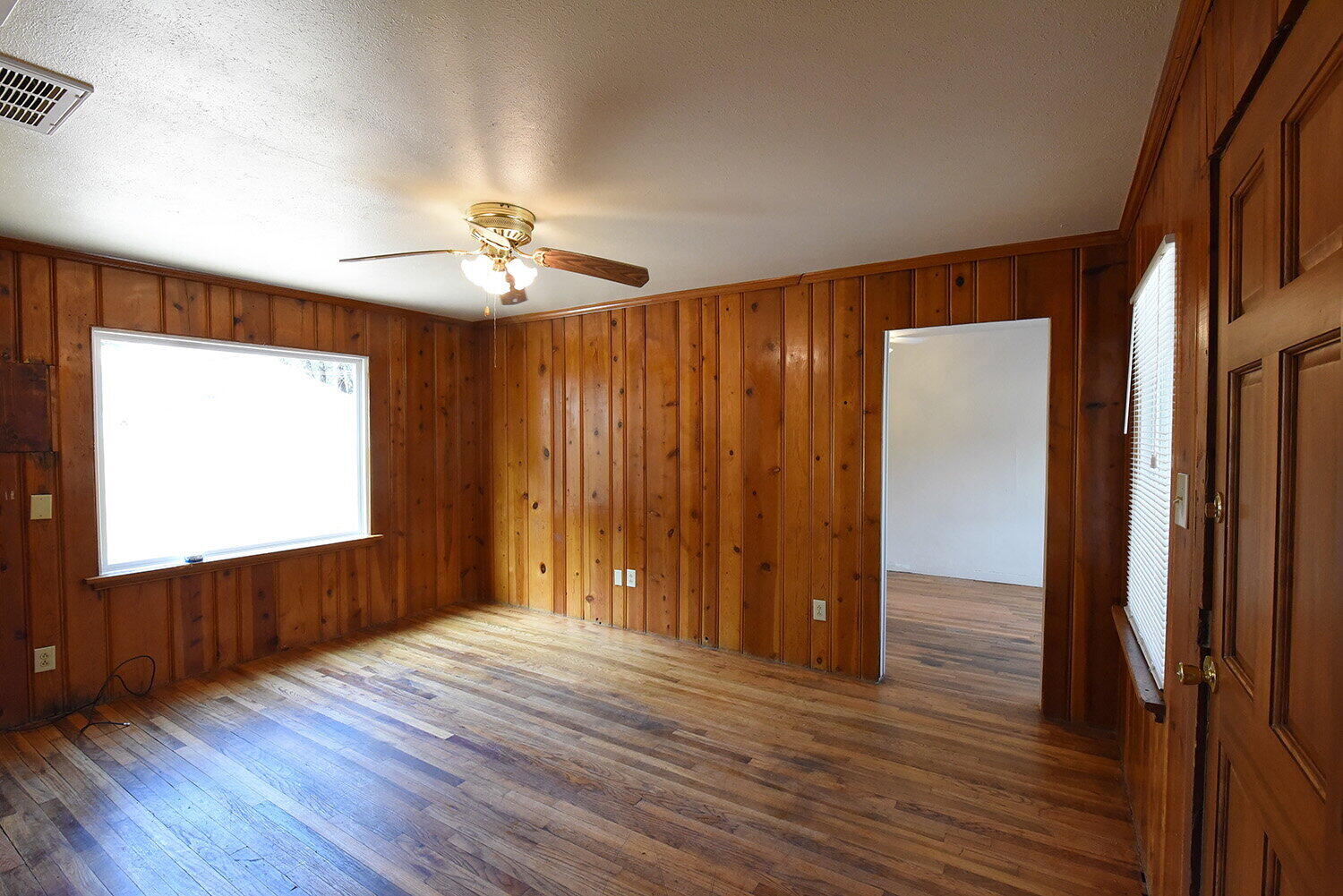 2006 29th Street, Unit FRONT Lubbock, TX 79411 - Photo 3 of 8 wooden floor in an empty room with a window