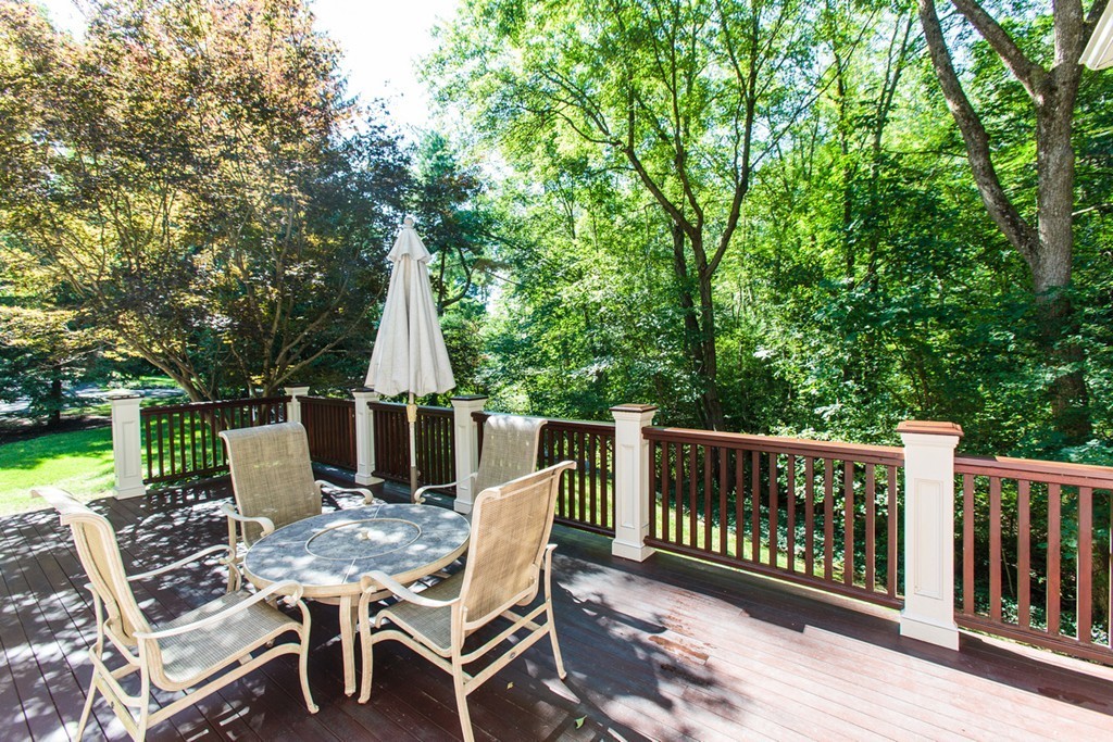 24 Sabrina Road Wellesley, MA 02482 - Photo 20 of 21 a view of a deck with a table and chairs