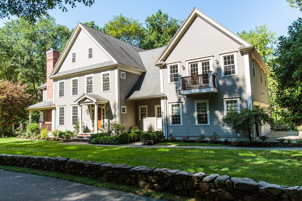24 Sabrina Road Wellesley, MA 02482 - Photo 2 of 21 a front view of a house with a yard and potted plants