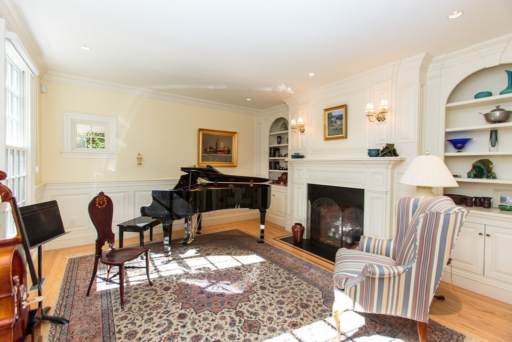 24 Sabrina Road Wellesley, MA 02482 - Photo 4 of 21 a living room with furniture and a fireplace