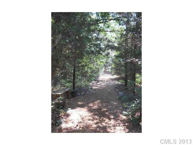 3671 East North Corner Road Lancaster, SC 29720 - Photo 2 of 16 a picture of a yard with street and trees