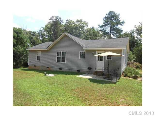 3671 East North Corner Road Lancaster, SC 29720 - Photo 13 of 16 a backyard of a house with table and chairs