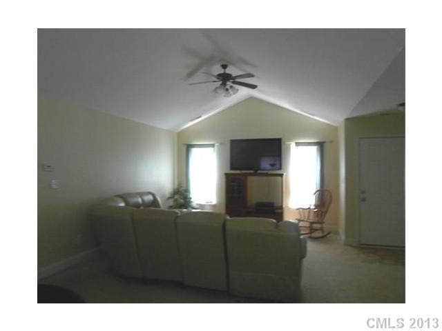 3671 East North Corner Road Lancaster, SC 29720 - Photo 5 of 16 a living room with furniture and a flat screen tv