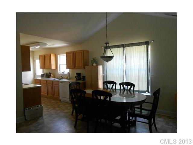 3671 East North Corner Road Lancaster, SC 29720 - Photo 6 of 16 a view of a dining room with furniture and window
