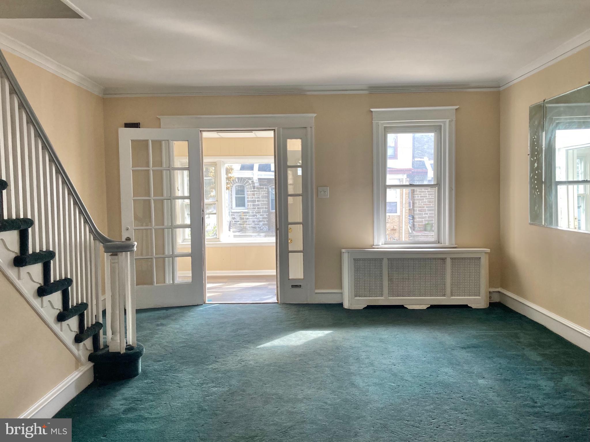 233 Avon Road Upper Darby, PA 19082 - Photo 4 of 15 Living Room looking towards enclosed Front Porch