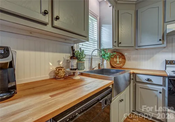 a kitchen with a sink and cabinets