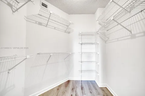 a view of a room with racks on the wall