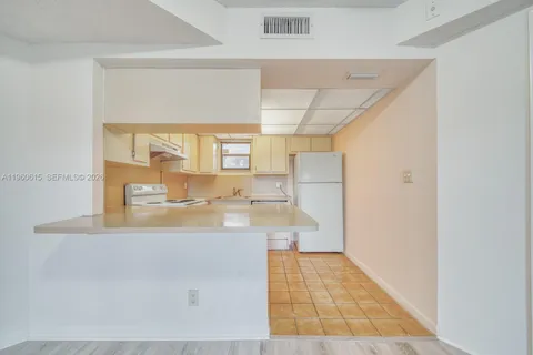 a view of kitchen and front door