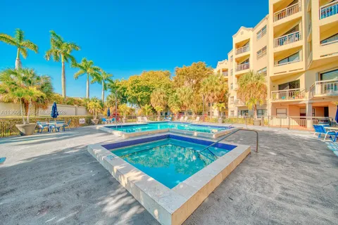 a view of a swimming pool with a lounge chairs
