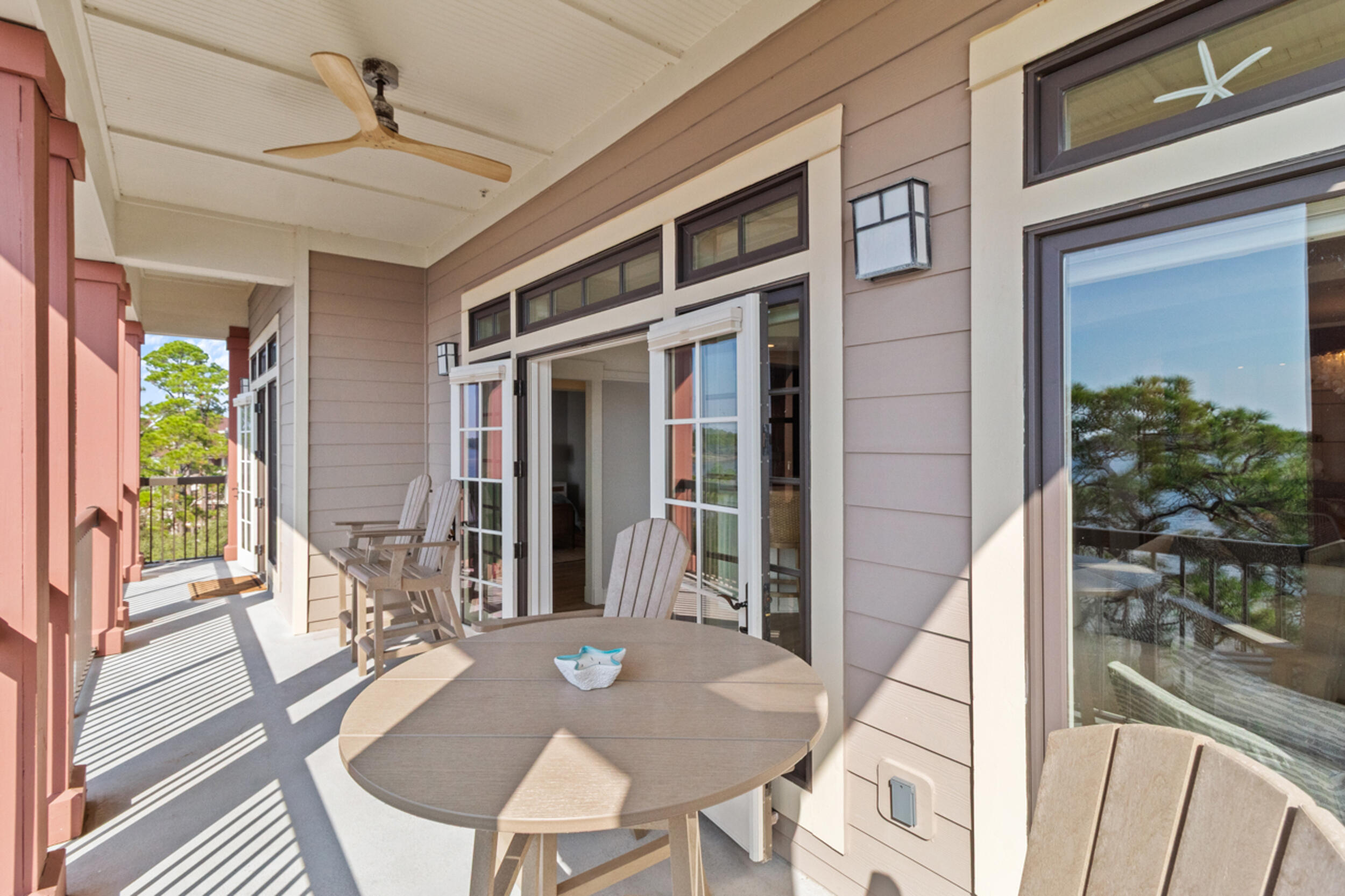 1101 Prospect Promenade, Unit 403 Panama City Beach, FL 32413 - Photo 28 of 74 a view of a house with backyard and porch
