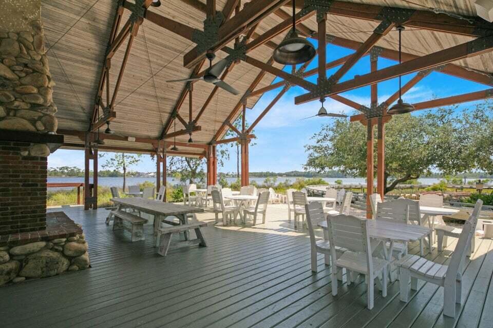 1101 Prospect Promenade, Unit 403 Panama City Beach, FL 32413 - Photo 41 of 74 a view of a swimming pool with outdoor seating