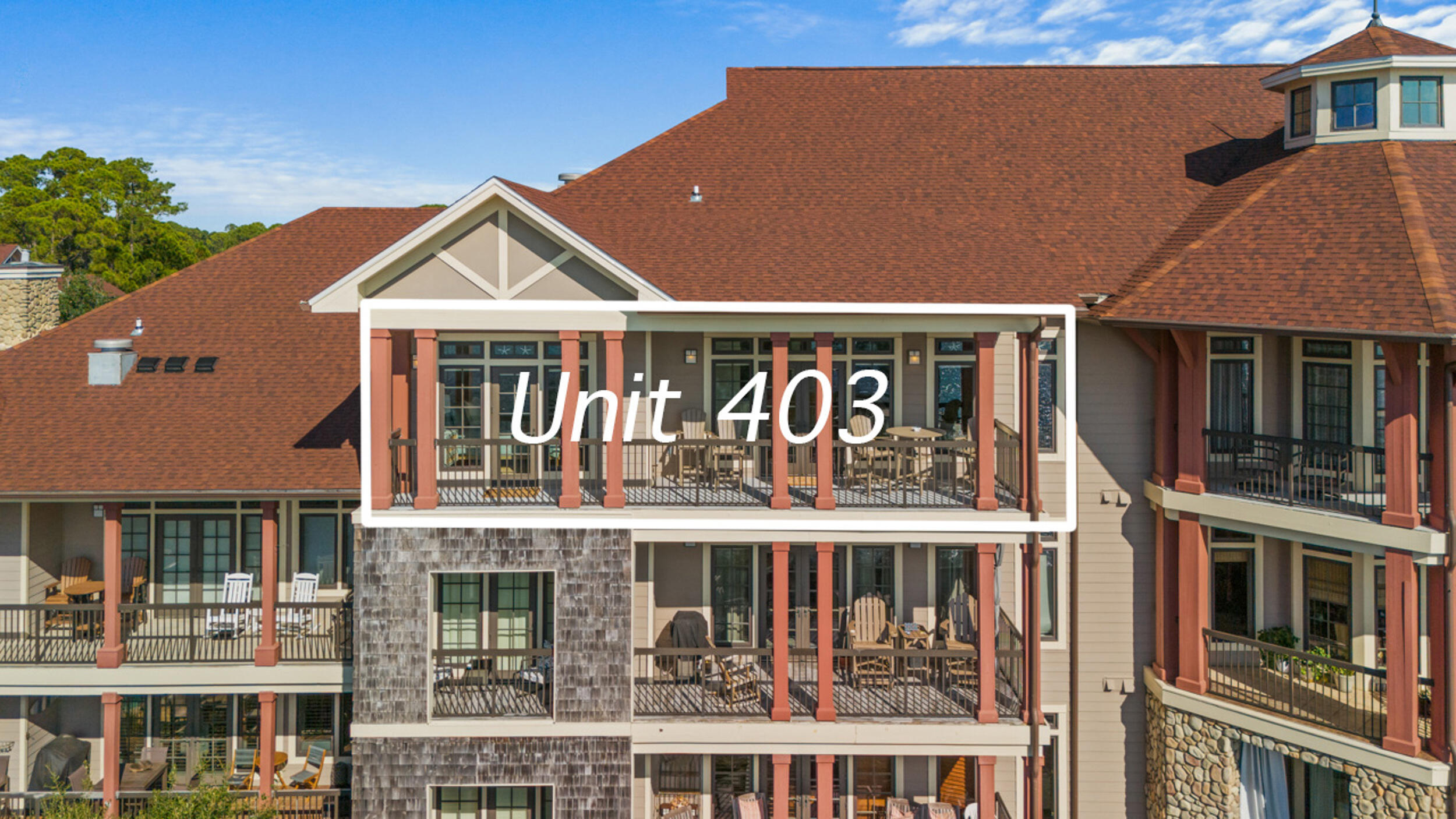 1101 Prospect Promenade, Unit 403 Panama City Beach, FL 32413 - Photo 60 of 74 a front view of a building with glass windows and door