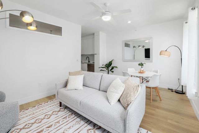 1701 Simond Avenue, Unit 615 Austin, TX 78723 - Photo 11 of 25 Open-concept living area with light wood-finish flooring, recessed lighting, and a ceiling fan
