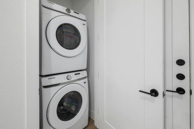 1701 Simond Avenue, Unit 615 Austin, TX 78723 - Photo 12 of 25 Compact laundry area featuring a stacked washer and dryer unit