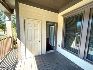 311 Centennial Bluff Boulevard Oak Ridge, TN 37830 - Photo 17 of 28 a view of a porch with wooden floor and floor to ceiling window