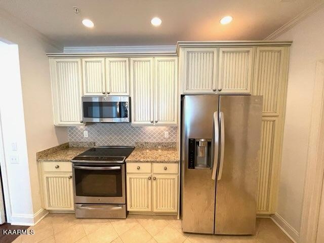 311 Centennial Bluff Boulevard Oak Ridge, TN 37830 - Photo 7 of 28 a kitchen with stainless steel appliances granite countertop a refrigerator and a stove
