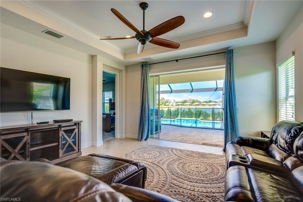 3782 Canopy Circle Naples, FL 34120 - Photo 11 of 31 a bedroom with a bed and glass door