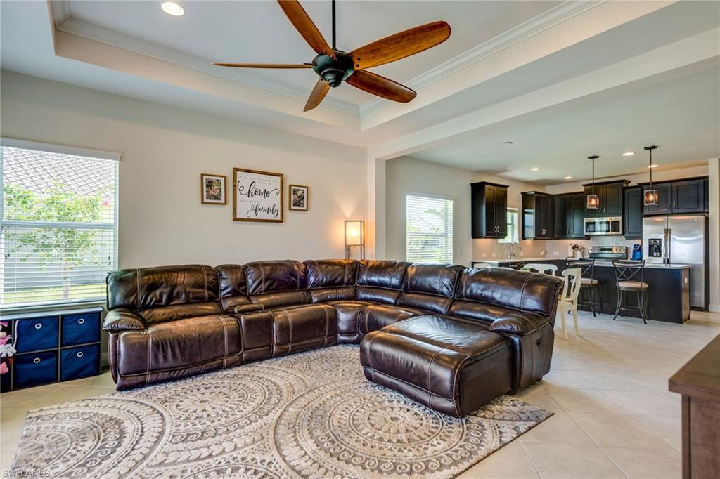 3782 Canopy Circle Naples, FL 34120 - Photo 13 of 31 a living room with furniture and a large window