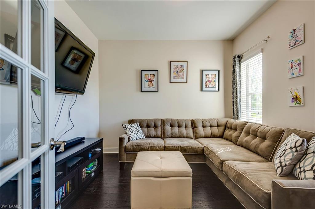 3782 Canopy Circle Naples, FL 34120 - Photo 18 of 31 a living room with furniture and a flat screen tv