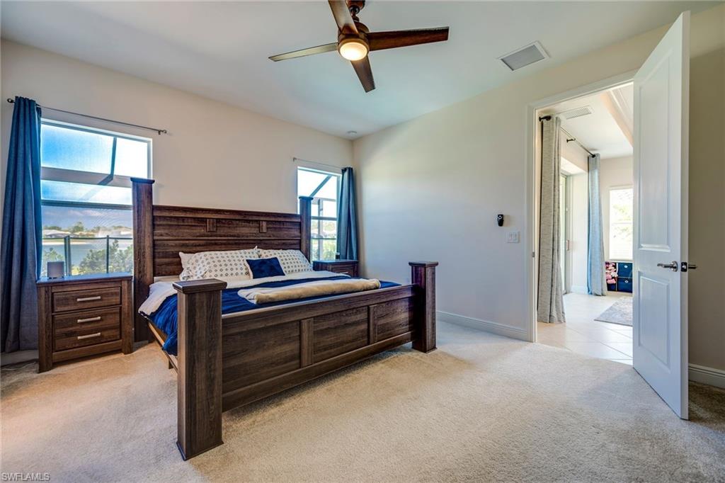 3782 Canopy Circle Naples, FL 34120 - Photo 20 of 31 a bed room with a bed and a window