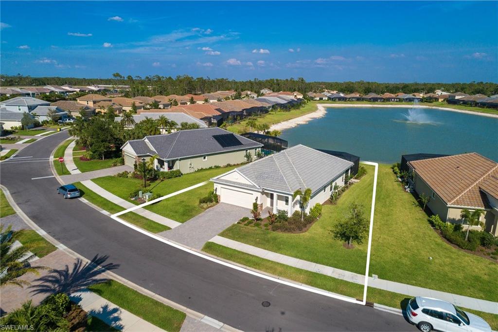 3782 Canopy Circle Naples, FL 34120 - Photo 2 of 31 an aerial view of a residential houses with outdoor space and ocean view