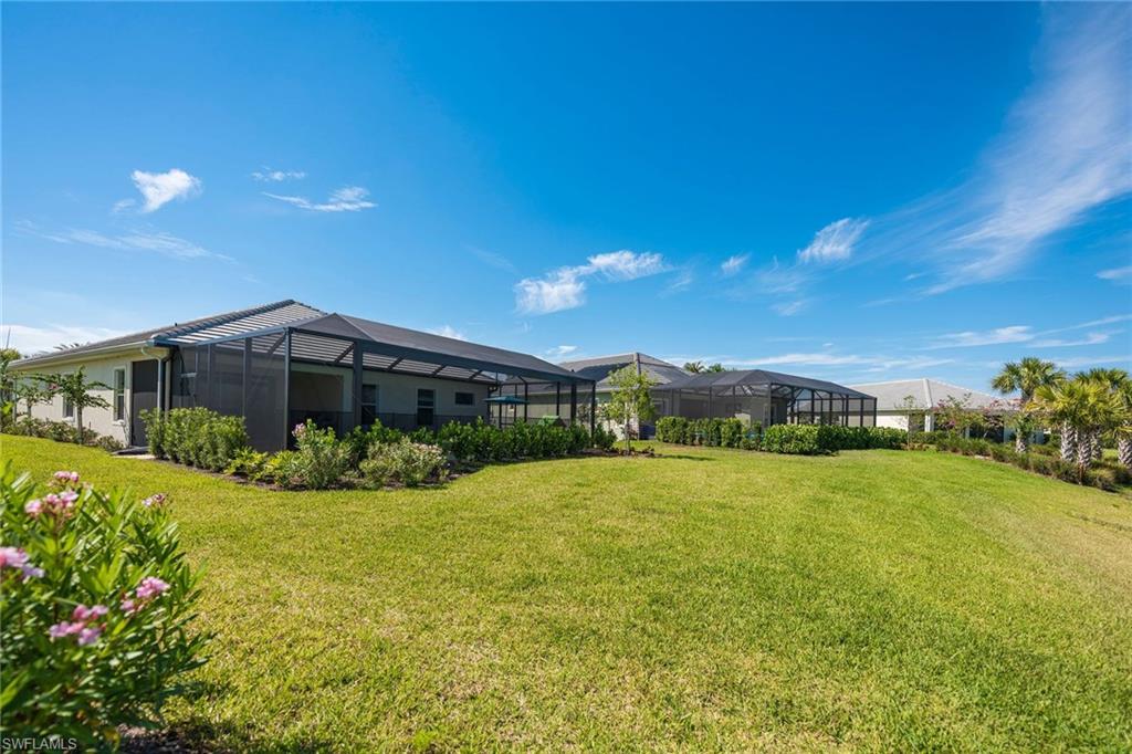 3782 Canopy Circle Naples, FL 34120 - Photo 28 of 31 a view of a house with a yard