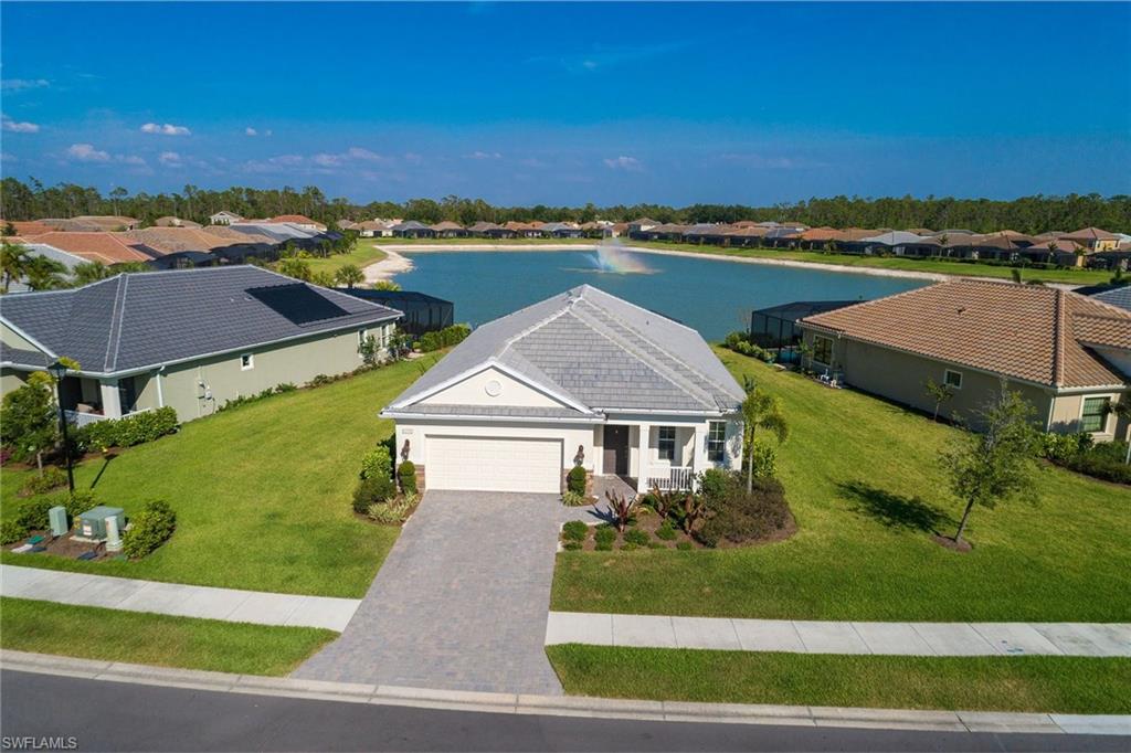 3782 Canopy Circle Naples, FL 34120 - Photo 29 of 31 an aerial view of a house with a garden and lake view
