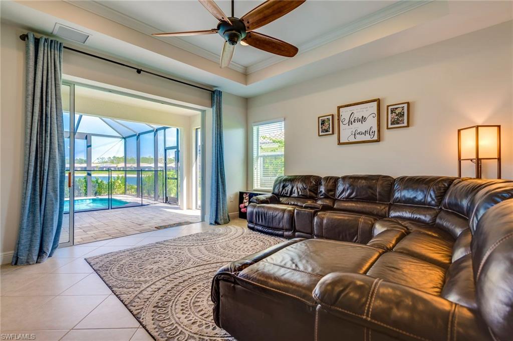 3782 Canopy Circle Naples, FL 34120 - Photo 6 of 31 a living room with furniture and a large window