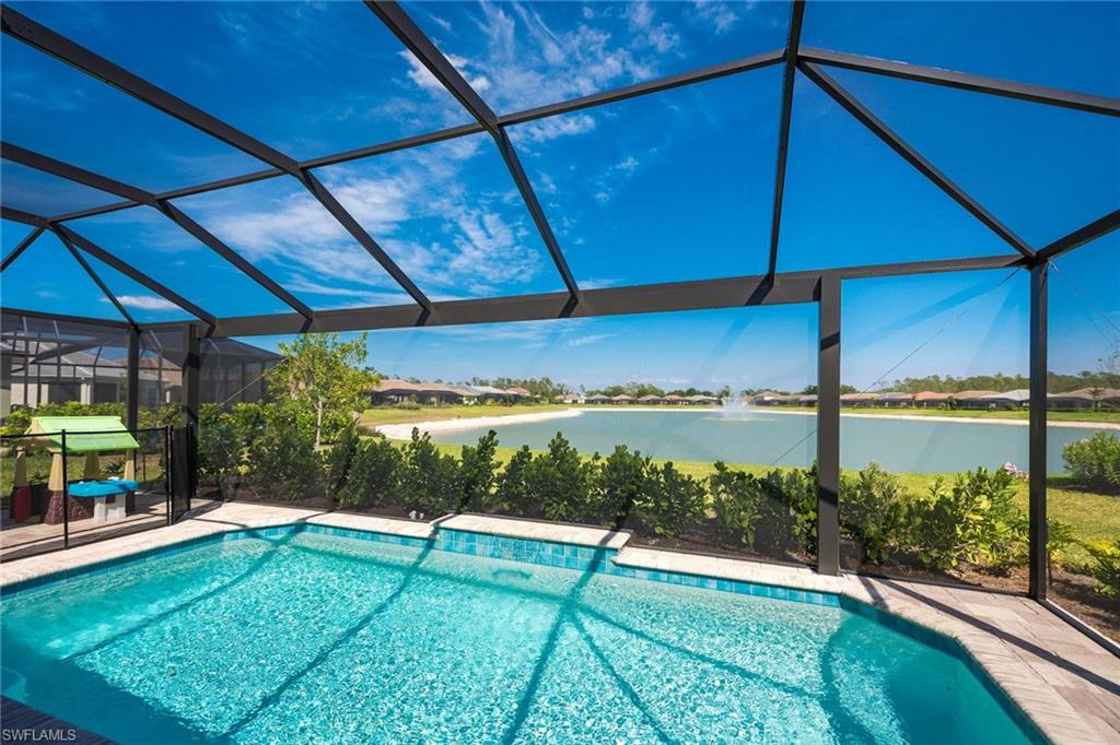 3782 Canopy Circle Naples, FL 34120 - Photo 8 of 31 a view of a two chairs under an umbrella
