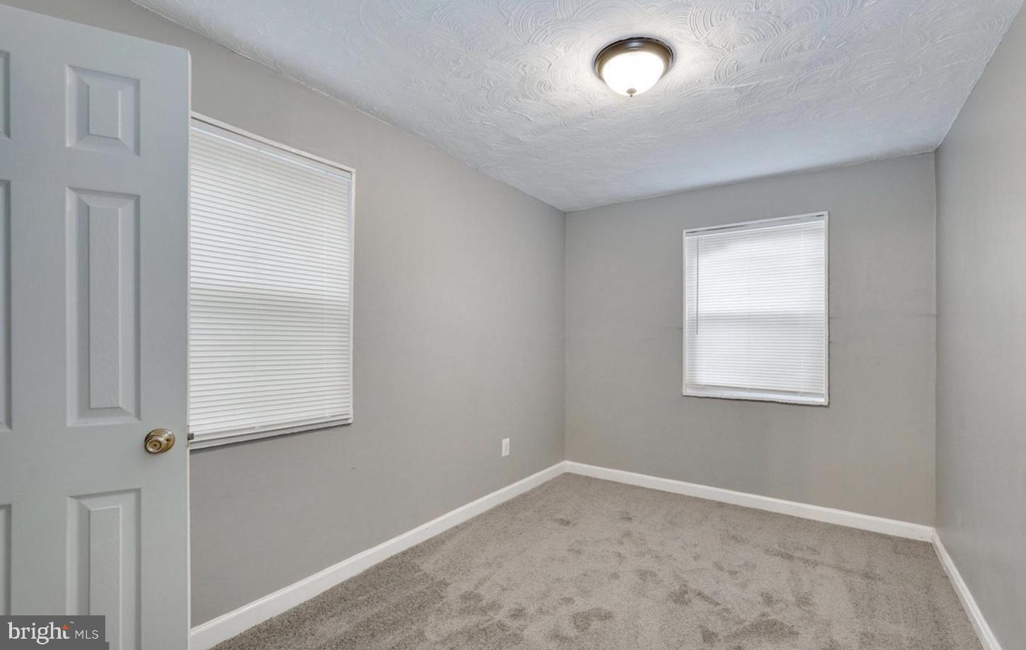 341 54th Street Northeast Washington, DC 20019 - Photo 12 of 16 an empty room with a window