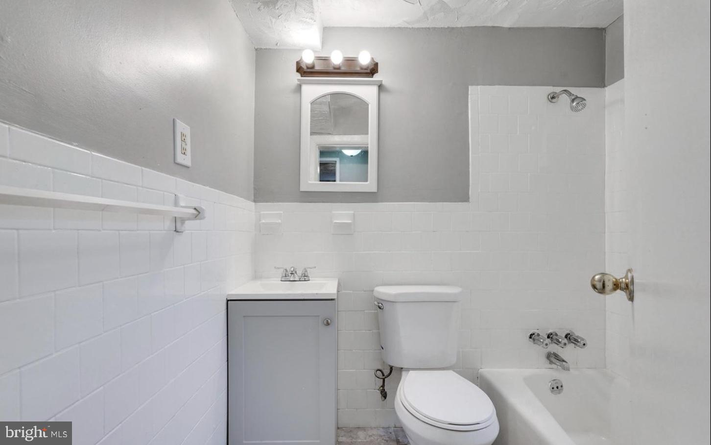 341 54th Street Northeast Washington, DC 20019 - Photo 15 of 16 a bathroom with a toilet sink and mirror