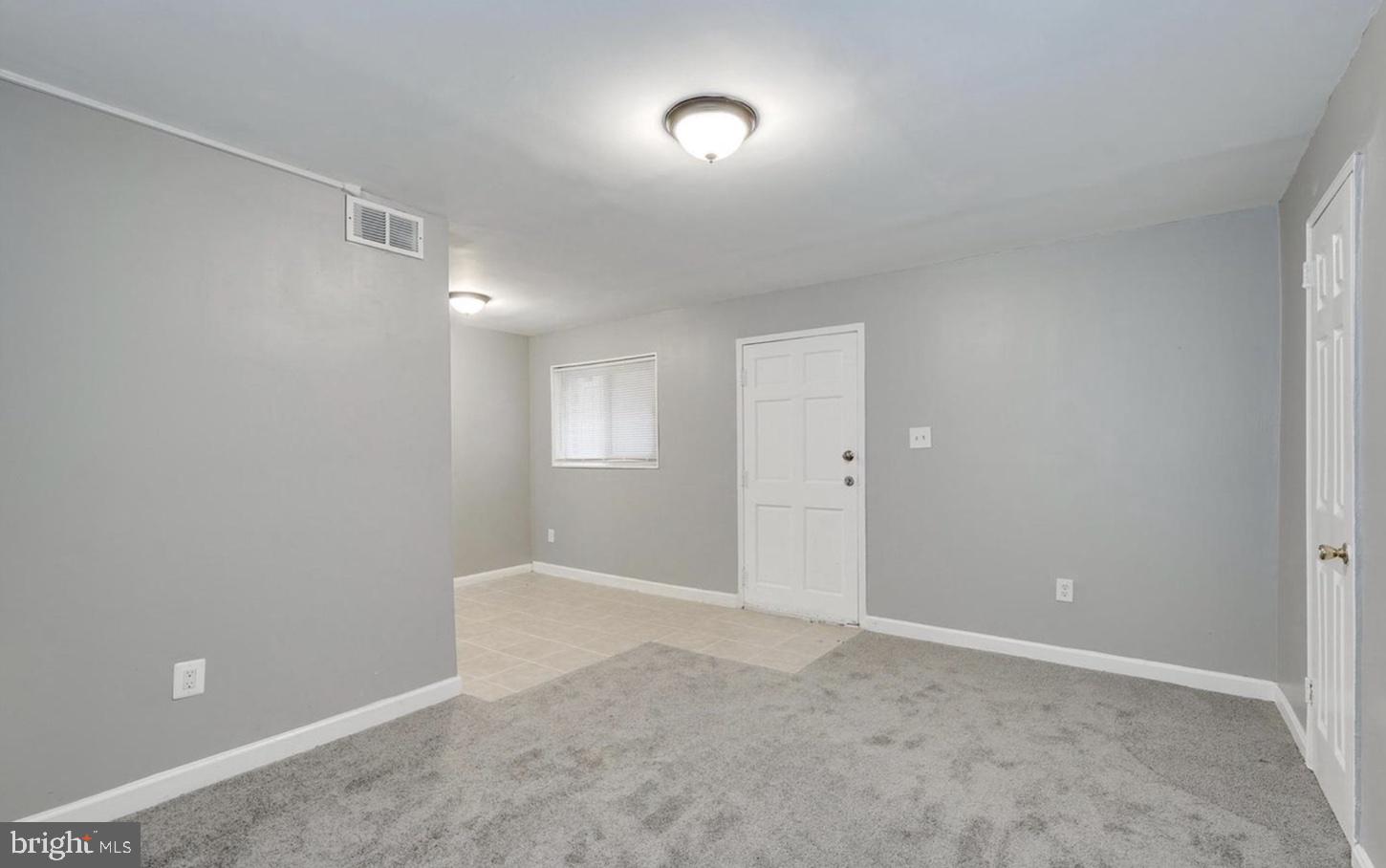 341 54th Street Northeast Washington, DC 20019 - Photo 7 of 16 a view of an empty room with a window