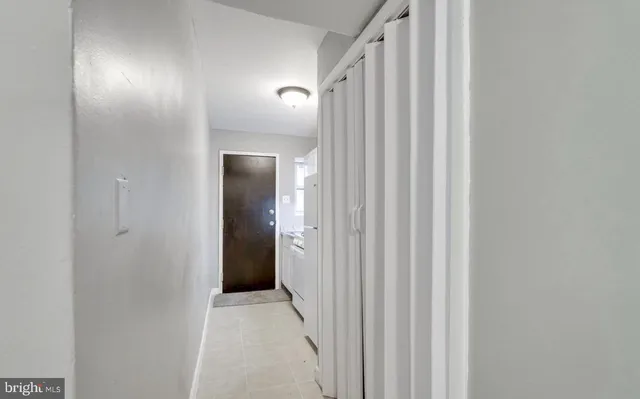 a kitchen with a refrigerator and washer