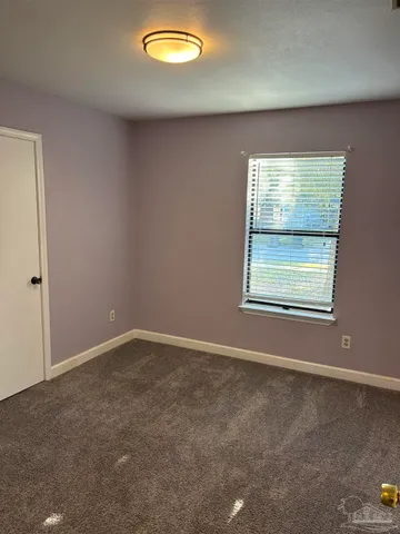 a bathroom with a sink vanity granite and a mirror