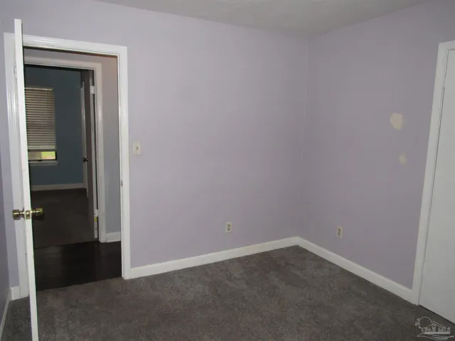 wooden floor and cabinet in an empty room