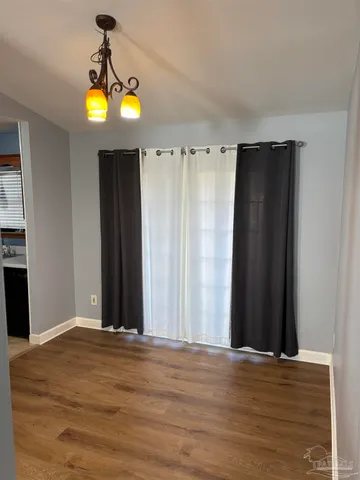 a view of a livingroom with wooden floor